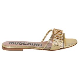 Moschino Sandali piatti con logo gioiello D'oro Metallico