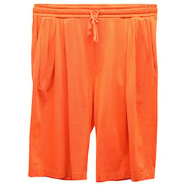 Dolce & Gabbana-Pantaloncini sportivi con logo ricamato Dolce & Gabbana in cotone arancione-Arancione