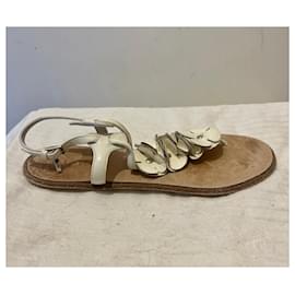Burberry-Flat Burberry sandals in a natural white patent leather-White
