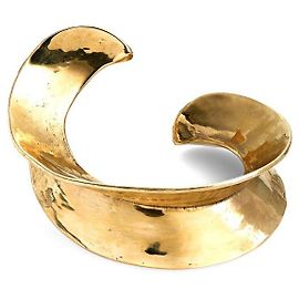Brazalete curvo dorado de Saint Laurent / Pulsera Gold hardware