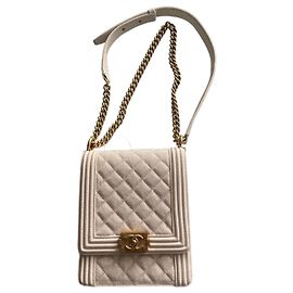 Bolsa Chanel North South Boy em couro caviar bege Bege