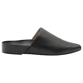 Stuart Weitzman Flat Mules in Black Leather Black