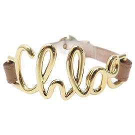 Chloé NOVA PULSEIRA CHLOE 2b0988 EM METAL DOURADO E COURO MARROM 15 NO 18CM NOVA JÓIA Dourado