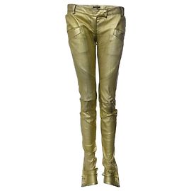 Balmain, metallic gold leather biker pants. Golden