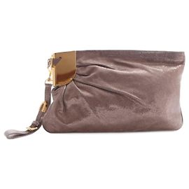 Jimmy Choo, pochette color oro con glitter e hardware dorato. D'oro