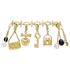 Louis Vuitton-Bracelet Louis Vuitton, "Idylle",  breloques, or jaune, or blanc, perles.-Autre