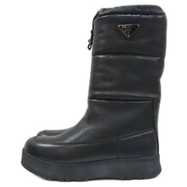 Botas de cuero con cuña baja de Prada Negro