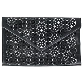 Alaïa Black studded envelope clutch Other