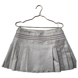 Minifalda plisada lamé dorada de CHANEL Dorado