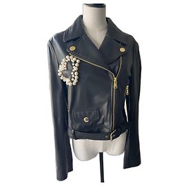Casaco Moschino em couro napa azul com detalhe de coração de pérolas Azul