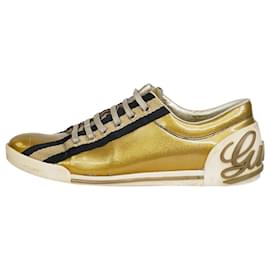 Gucci-Sapatilhas douradas com logótipo brilhante e escrita - tamanho UE 37.5-Dourado