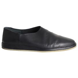 Fear of God Angst vor Gott: Die Mule Flats aus schwarzem Leder Schwarz