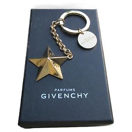 porte clé/bijou de sac givenchy signé neuf dans boîte Doré