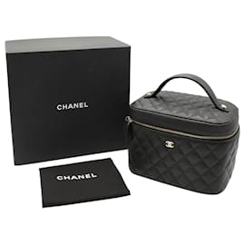 Chanel-Trousse de toilette matelassée Chanel en cuir caviar noir-Noir