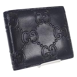 Gucci-Cartera corta de cuero con cartera plegable con relieve GG de Gucci en buen estado-Negro