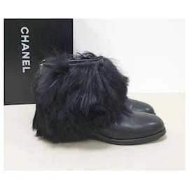 Chanel-Chanel schwarze Leder-Kunstpelzstiefel-Schwarz