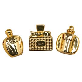 Broche en forme de flacon de parfum Dior plaqué or en excellent état Doré