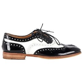 Brogue stringate Church's in pelle verniciata bianca e nera Nero