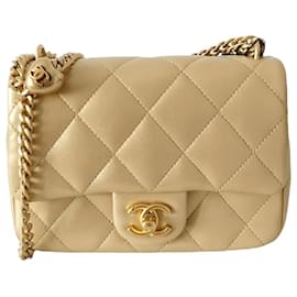 Chanel-Borsa Chanel Timeless Classique Mini Flap in pelle dorata 23P-D'oro