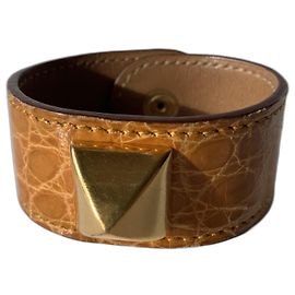 Pulseira Hermès Joli Médor crocodilo açafrão dourada Dourado