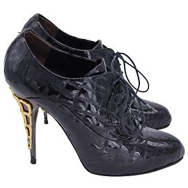 Giuseppe Zanotti Botins acolchoados com cadarço e salto alto em couro envernizado preto Preto