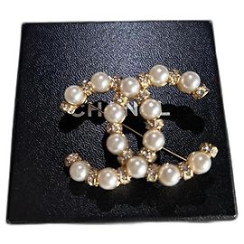 Chanel Pins e spille Bianco D'oro