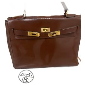 Hermès Kelly 32 dark brown patent leather handbag Dark brown