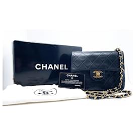 Chanel-Bolsa Chanel Mini Timeless em couro preto acolchoado-Preto
