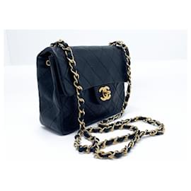 Chanel-Bolsa Chanel Mini Timeless em couro preto acolchoado-Preto