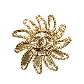 Chanel-Broche dorée à motif soleil CC Chanel-Doré
