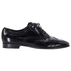 Brogue stringate Prada in pelle verniciata nera Nero