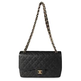 Chanel-Borsa con patta classica foderata in caviale trapuntato nero Chanel-Nero