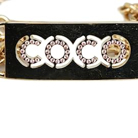 Chanel-Cinturón dorado con eslabones de cadena y placa con nombre de Coco con diamantes de imitación de Chanel-Dorado