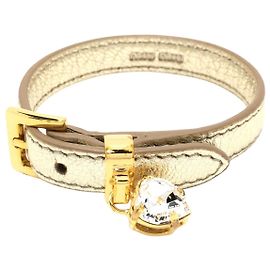 miu miu Dourado