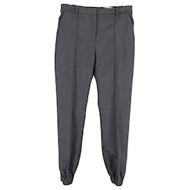 Alexander Mcqueen-Pantaloni Alexander McQueen con polsini elasticizzati in cotone grigio-Grigio