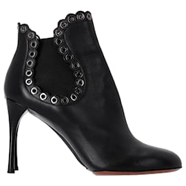 Alaïa-Alaïa Eyelet Ankle Boots in Black Leather-Black