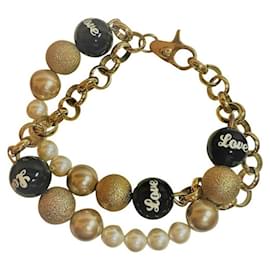 Dolce & Gabbana-Bracelet doublé DOLCE & GABBANA en chaîne dorée, Perles blanches, or et noir-Doré