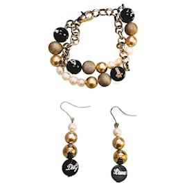 Dolce & Gabbana-Bellissima luminosa parure acciaio dorato e perle bracciale più orecchini DOLCE & GABBANA con, perle bianche, oro e nere-D'oro