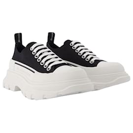 Alexander Mcqueen-Tread Slick Sneakers aus schwarzem und weißem Stoff-Schwarz