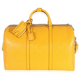 Duffle conversível GG em couro de bezerro perfurado em relevo amarelo Gucci Amarelo