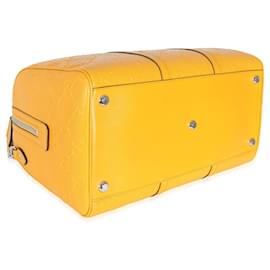 Gucci-Bolsa de viaje convertible con GG de piel de becerro perforada y grabada en amarillo Gucci-Amarillo