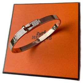 Bracciale Hermès Kelly in oro rosa e diamanti D'oro