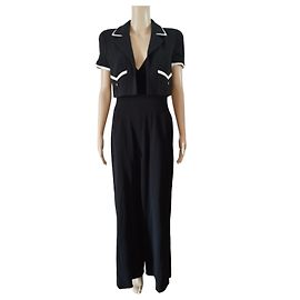 Raro set giacca e gonna corta Chanel della collezione 95P Nero