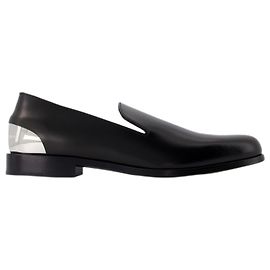 Loafer mit Metallabsatz – Alexander McQueen – Leder – Schwarz/Silber Schwarz