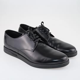 Prada-Zapatos planos con cordones negros de Prada-Negro