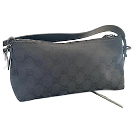 Gucci-Gucci canvas clutch with black leather handle-Monogram