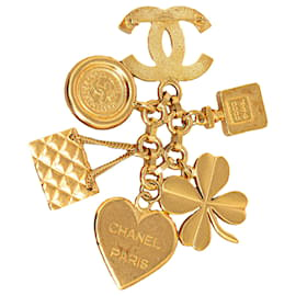 Chanel-Spilla Chanel con icona in oro e charms-D'oro
