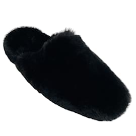 Balenciaga-Mules tipo peluche de piel sintética negra de Balenciaga-Negro
