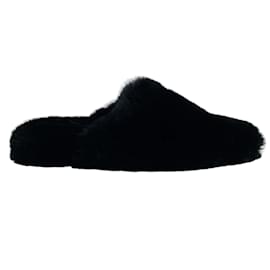 Balenciaga-Mules tipo peluche de piel sintética negra de Balenciaga-Negro