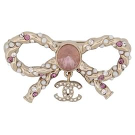 NUEVO BROCHE CHANEL LAZO LOGO CC Y LAZO DE METAL DORADO STRASS ROSA BROCHE NUEVO Dorado